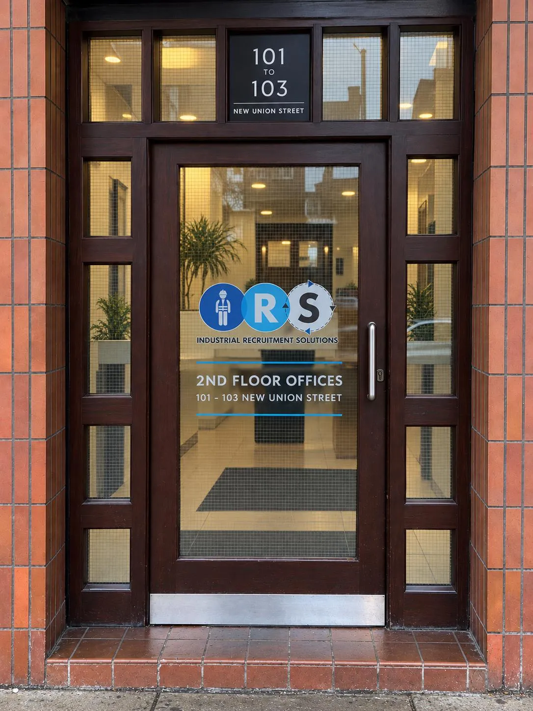 The entrance to IRS Group's Coventry office at 101 to 103 New Union Street, with the IRS logo and “2nd floor offices” on the door